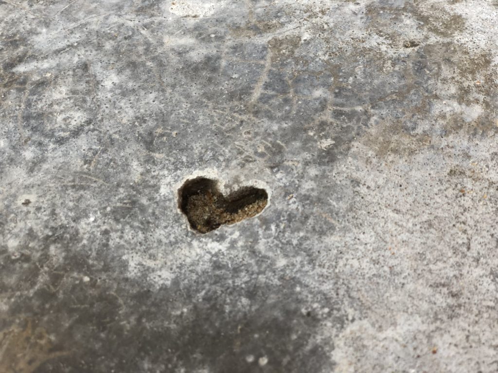 Heart symbol moulded into concrete embankment