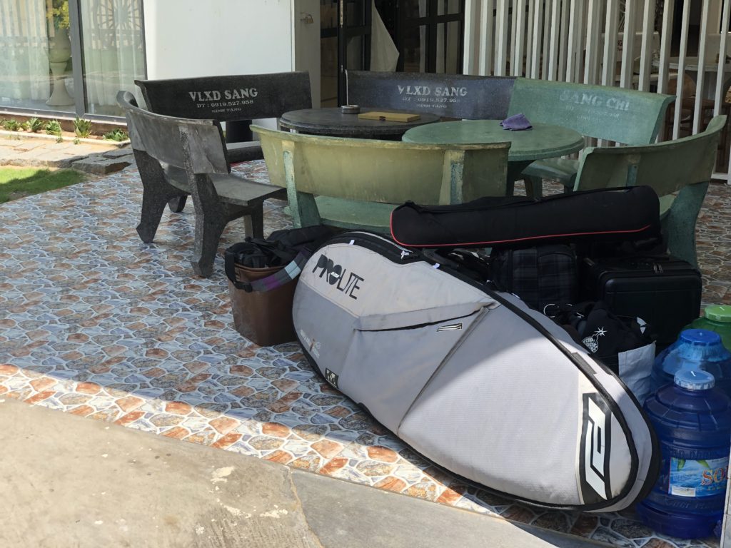 Surfboard bags, tripod bag, 8 suitcases and other bags