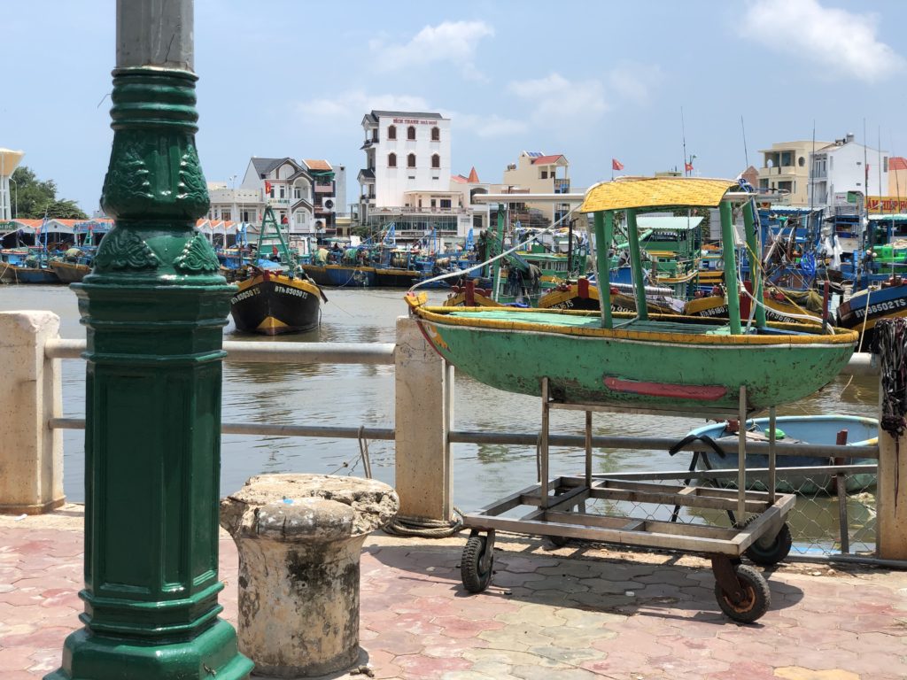 Colourful boats on the river at Phan Thiet Street