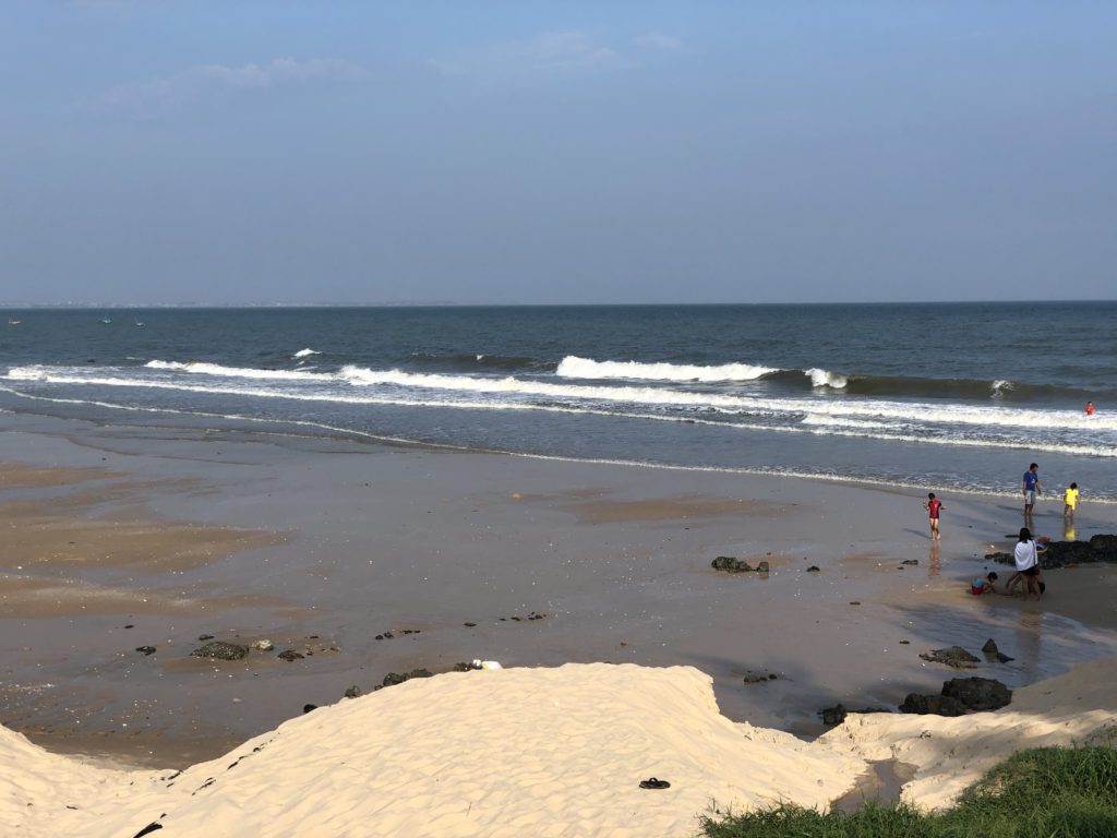 Beach at Phan Thiet Resort with waist-size waves breaking
