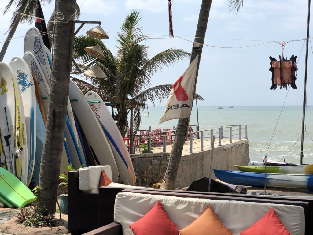 Surf shop in Phan Thiet, with kiteboards and surfboards.