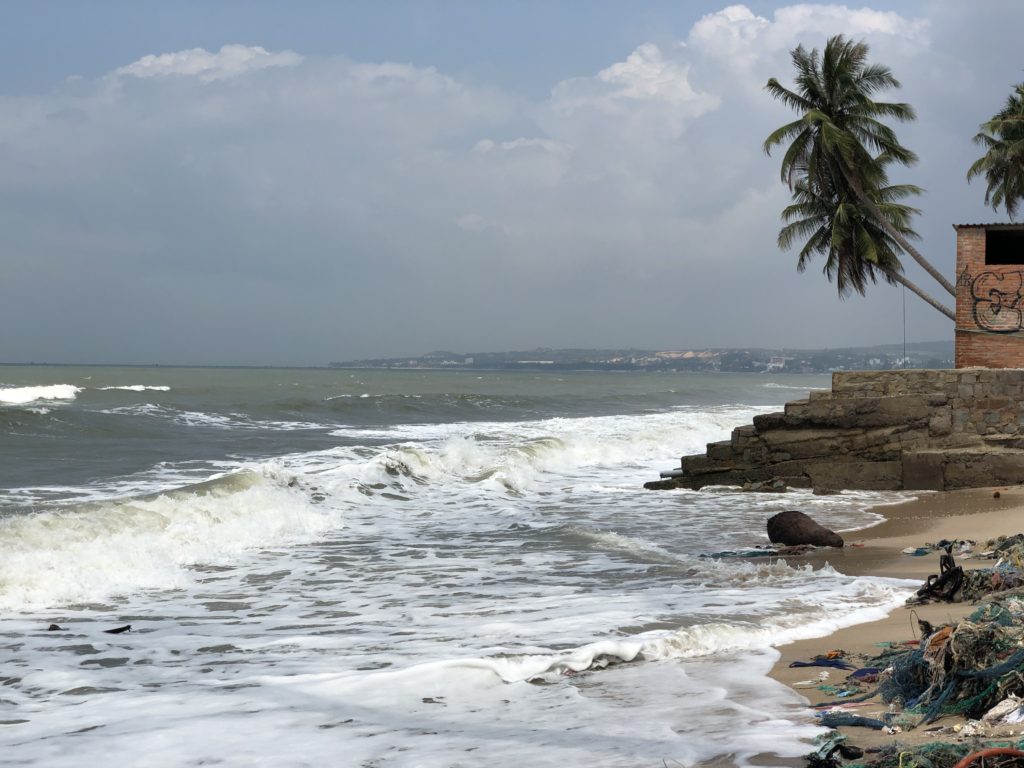 Shorebreak hitting the beach eroding Phan Thiet beach